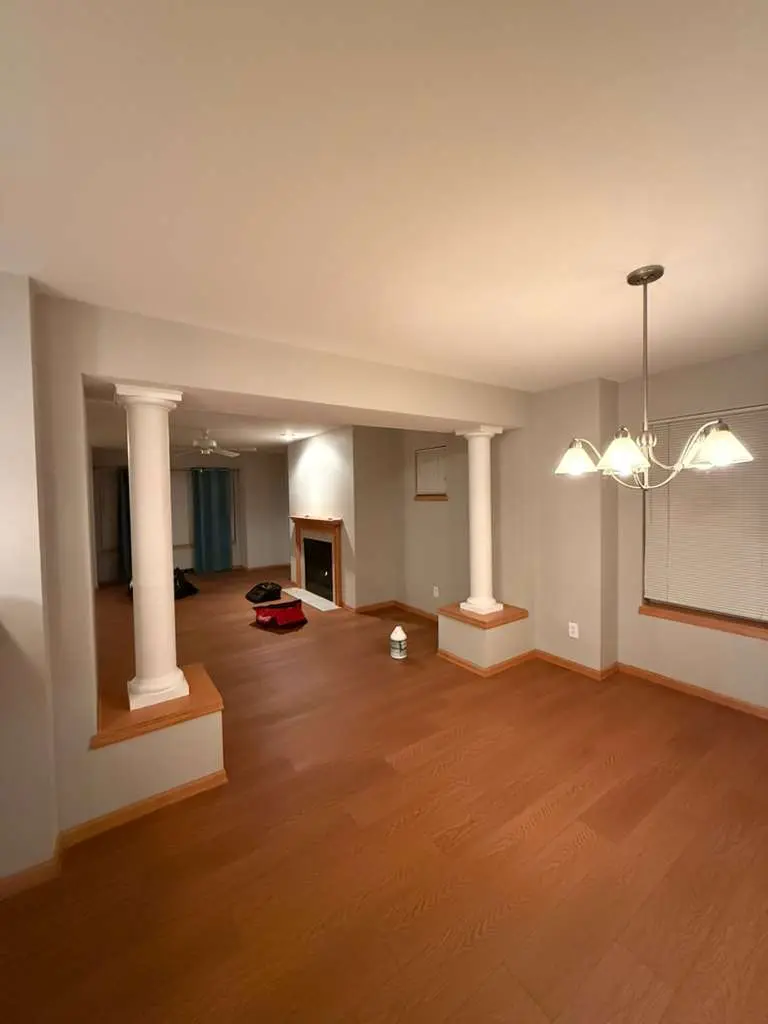 Freshly painted open living room with warm hardwood floors in Dane County, WI